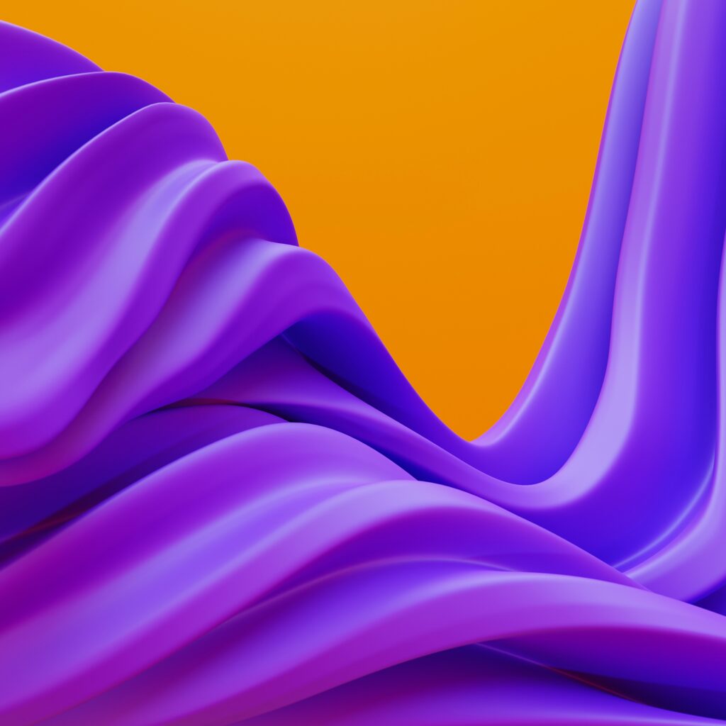 Abstract image featuring flowing, smooth waves of vibrant purple against a bright orange background, creating a dynamic contrast and sense of motion.
