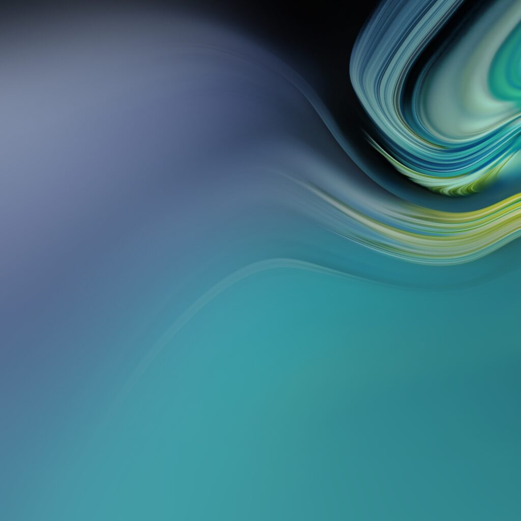 Abstract image featuring smooth, flowing gradients with shades of blue, teal, and hints of green and yellow. The composition creates an impression of movement and fluidity, resembling a blend of ocean waves and soft light patterns.
