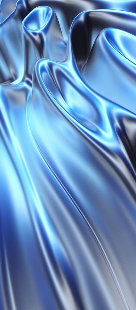 A smooth, flowing surface with metallic, reflective blue hues creating a wavy pattern, resembling fluid silk or liquid metal under light, evoking a sense of movement and elegance.
