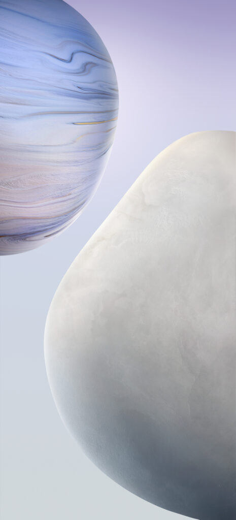 A minimalist image featuring two abstract, planet-like spheres. The upper sphere has blue and purple swirling patterns, while the lower sphere is smooth and off-white. The background is a gradient of soft purple and blue tones.
