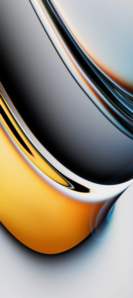 A close-up abstract image featuring smooth, curved surfaces with reflective qualities. The colors blend from rich gold to silver and gray tones, creating a fluid, metallic appearance with a glossy finish.
